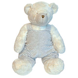 White teddy bear with grey striped overalls.