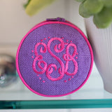 Hand Embroidered Round Jewelry Case in purple with pink lettering