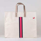 Natural cotton canvas tote with navy and pink stripe and leather  handles 