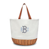 White picnic basket tote with wicker bottom and leather handles.