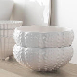 Two white sea urchin bowls stacked