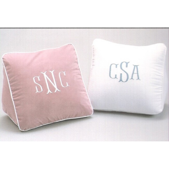 Pink and white wedge pillows with monograms
