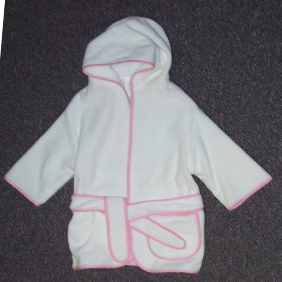 White children's hooded cover up with pink piping